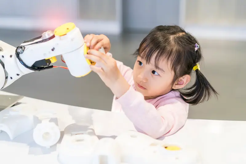 Young girl with robot
