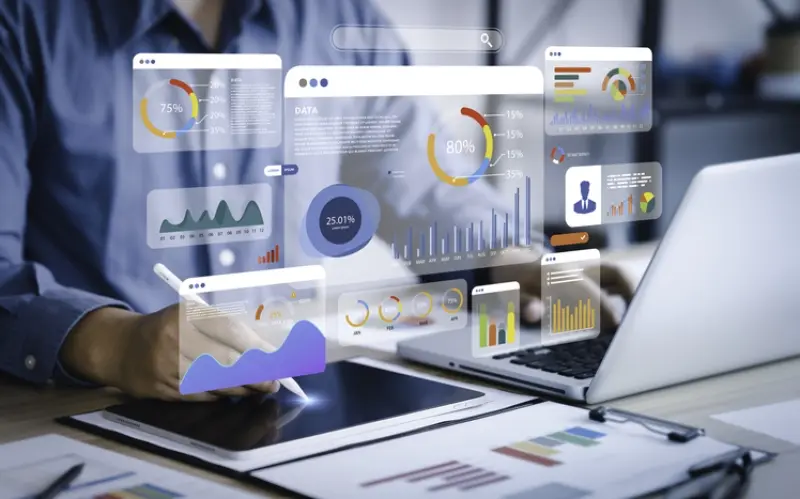 automation graphics for financial data, man at laptop