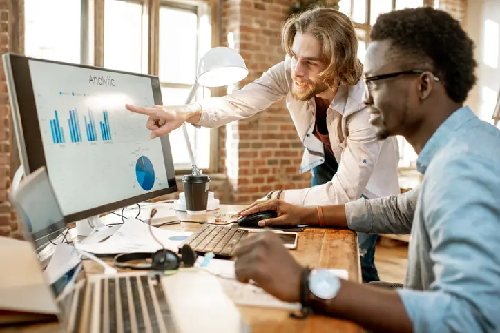 analysts two men looking at graphs