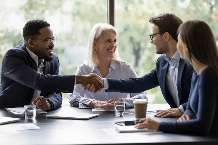meeting group of business people shaking hands